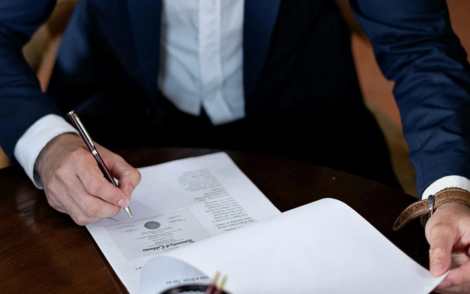 Professional legal paperwork signing used to represent solicitor and legal document delivery